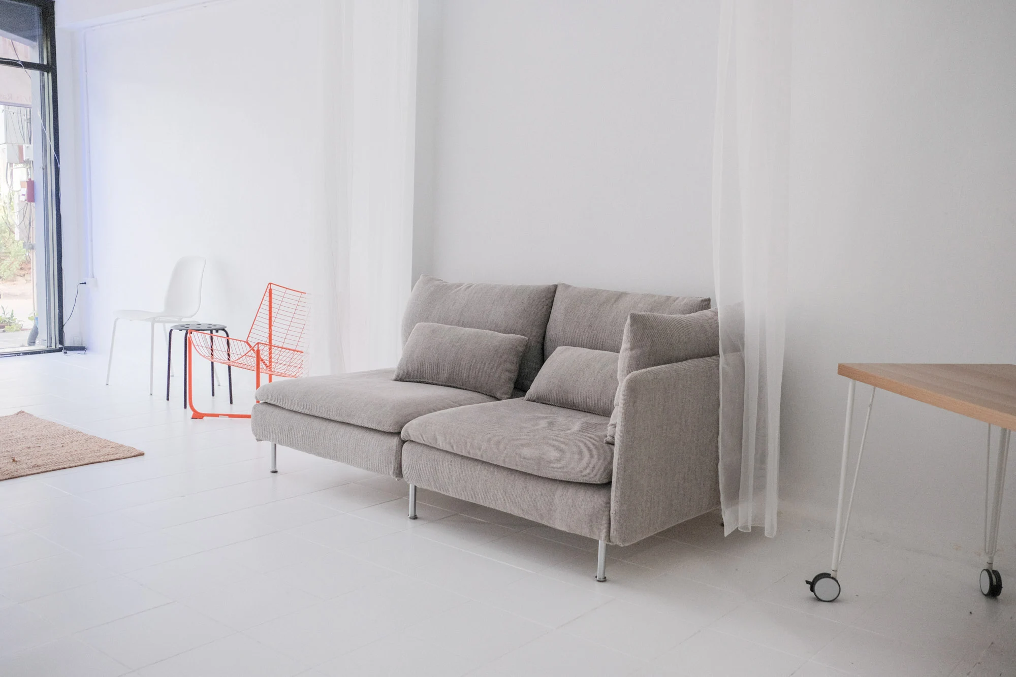 Downstairs lifestyle photography and product photography studio in Chiang Mai featuring curved archways and aesthetic furniture